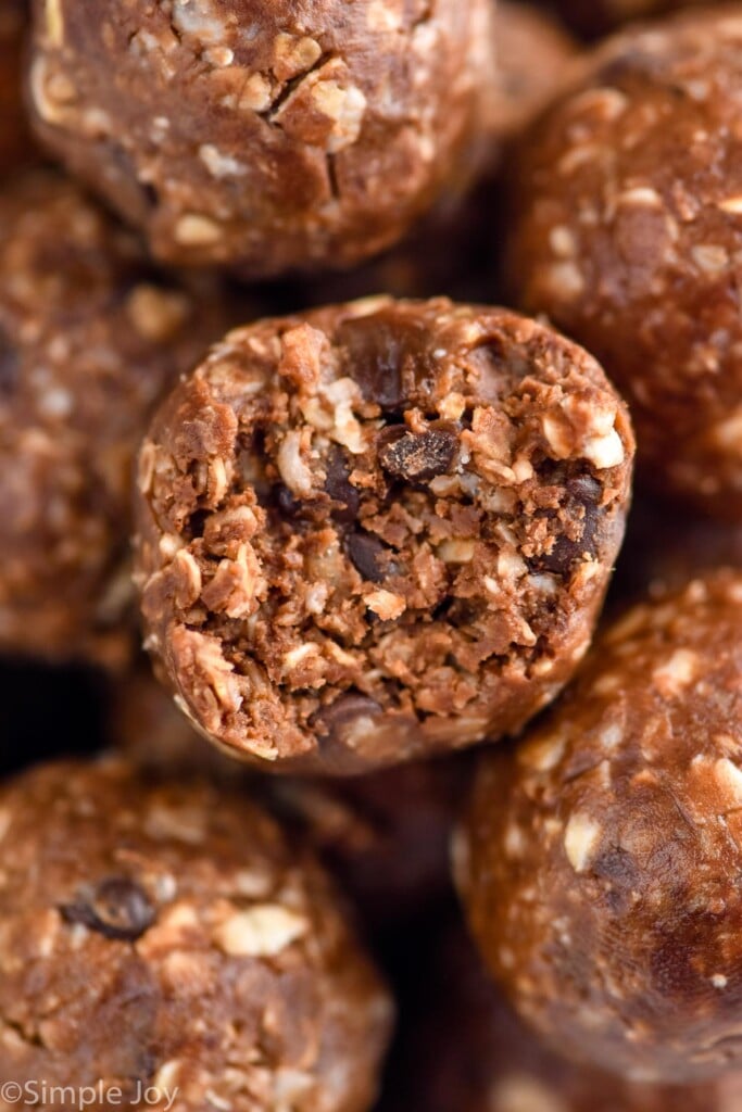Close up photo of Chocolate No Bake Energy Bites with a bite taken out of one