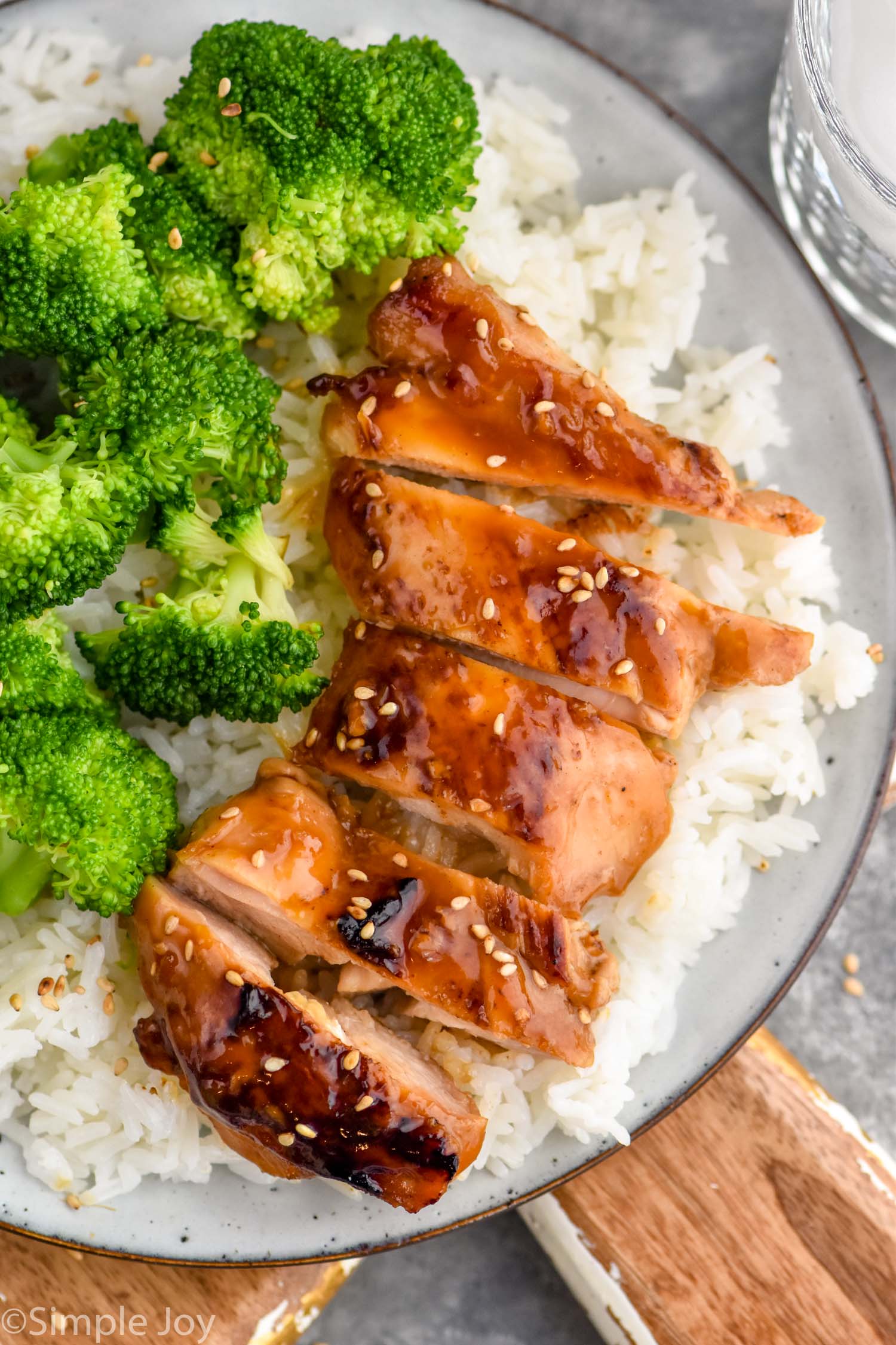 Overhead photo of a plate of Teriyaki Chicken, rice, and broccoli.