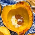 Roasted Acorn Squash on a plate. Bowl of brown sugar sitting beside - 8