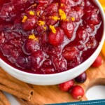 Pinterest graphic for Cranberry Sauce. Image shows a bowl of homemade Cranberry Sauce. Text says "homemade cranberry sauce simplejoy.com"