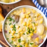 Overhead photo of bowl of Crockpot Corn Chowder with spoon beside