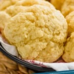 pinterest graphic of a drop biscuit in a basket with other drop biscuits, says: "tried and tested drop biscuits simplejoy.com"