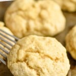 pinterest graphic of fast and easy drop biscuits being picked up by a metal spatula off a baking sheet, says: "the best drop biscuits simplejoy.com"