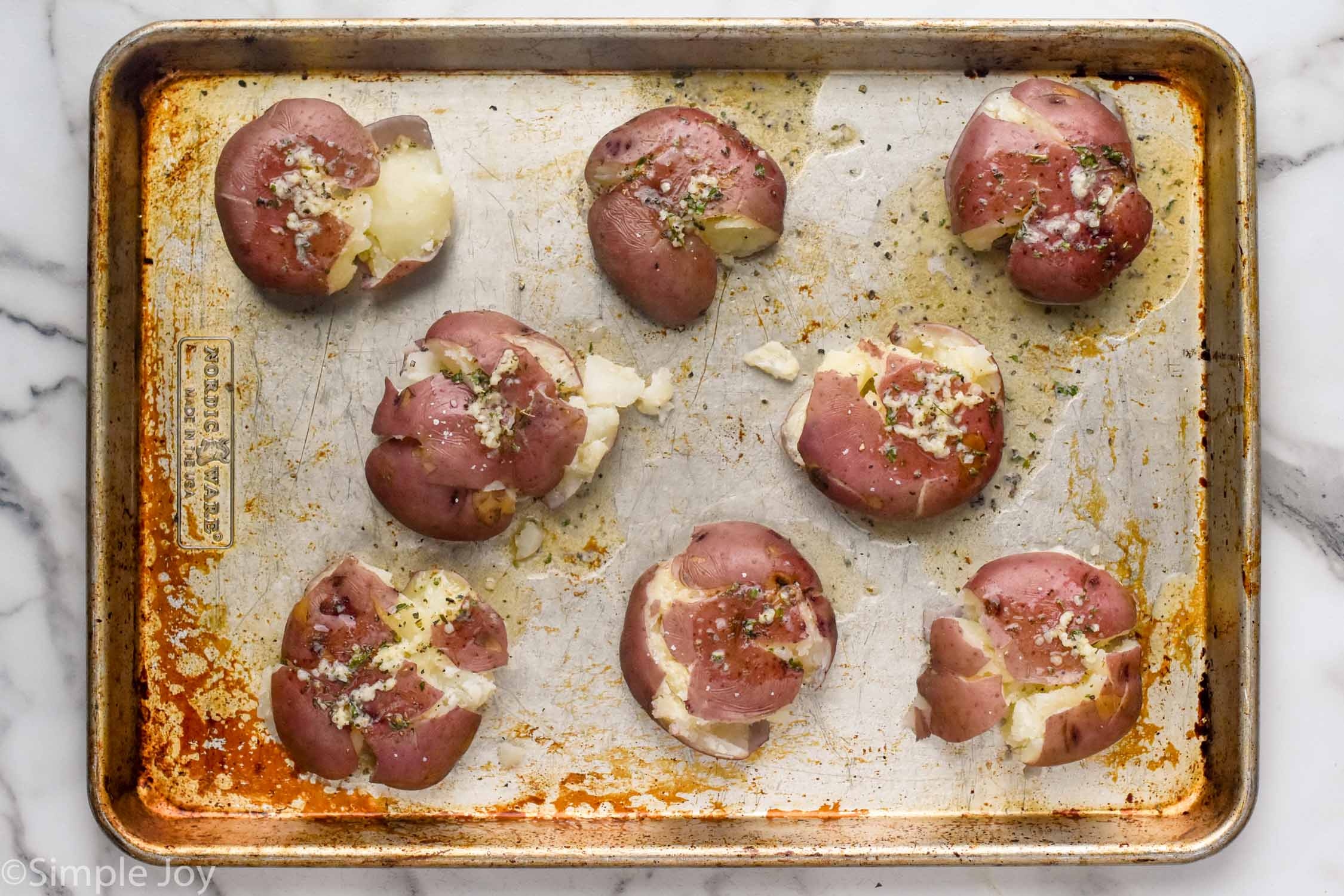 overhead of Smashed Potatoes on a baking sheet