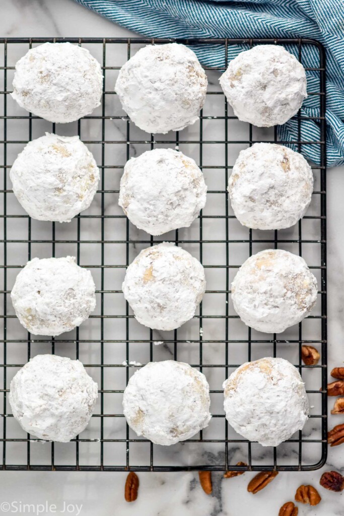 cooling rack with snowball cookies