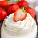 Pinterest graphic for Homemade Whipped Cream recipe. Text says, "the best whipped cream simplejoy.com." Image shows a jar of Homemade Whipped Cream with strawberries.