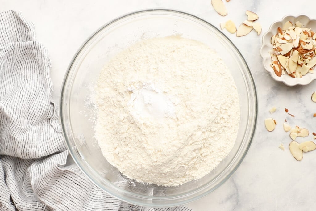 overhead of dry ingredients whisked tougher in a bowl to make biscotti cookies