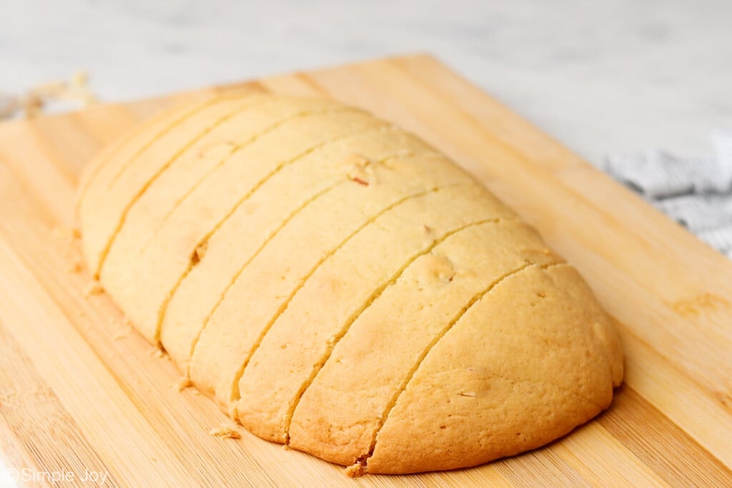a sliced biscotti log on a cutting board