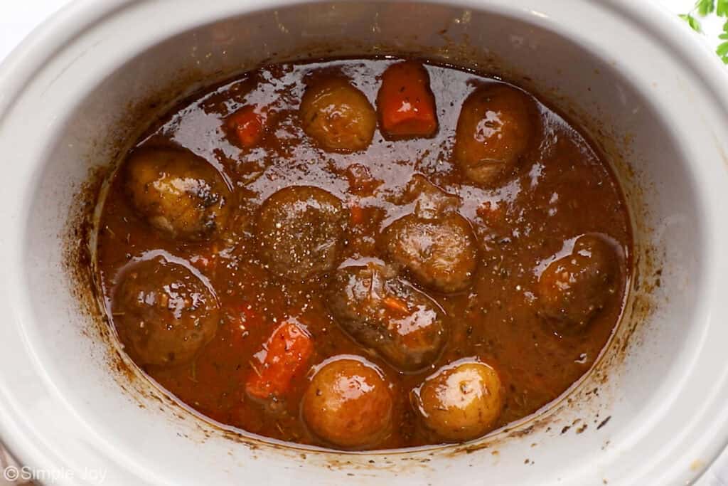Overhead of slow cooker of slow cooker pot roast ingredients