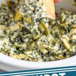 Pinterest graphic for Crockpot Spinach Artichoke Dip recipe. Image shows person's hand dipping a chip into Crockpot Spinach Artichoke Dip. Text says, "crockpot artichoke spinach dip simplejoy.com"