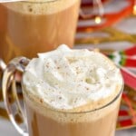 Pinterest graphic for Eggnog Latte recipe. Text says, "The best Eggnog Latte simplejoy.com." Image shows a mug of Eggnog Latte garnished with whipped cream.