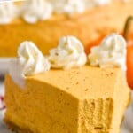 Pinterest graphic for No Bake Pumpkin Cheesecake recipe. Text says, "No Bake Pumpkin Cheesecake simplejoy.com." Image shows a slice of No Bake Pumpkin Cheesecake served on a plate with one bite taken out.