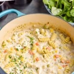 Pinterest graphic for Turkey Soup recipe. Text says, "creamy Turkey Soup simplejoy.com." Image shows a pot of Turkey Soup with a bowl of salad beside.