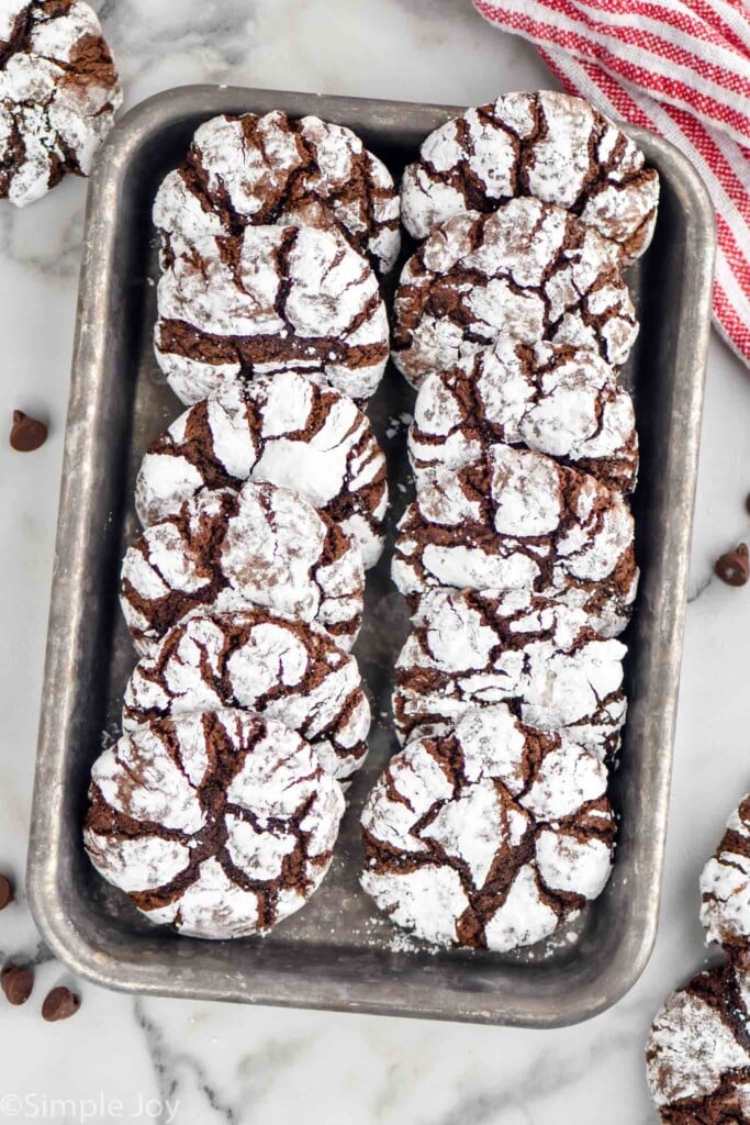 Overhead photo of Chocolate Crinkle Cookies in a tin
