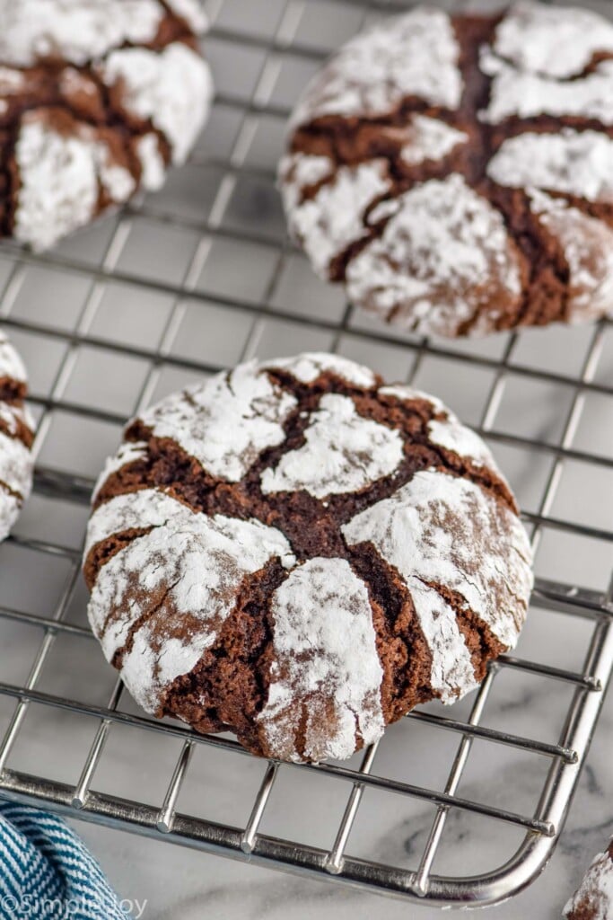 Close up photo of Chocolate Crinkle Cookies on a cooling rack