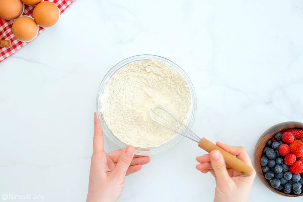 dry ingredients being whisked together to make coffee cake muffins