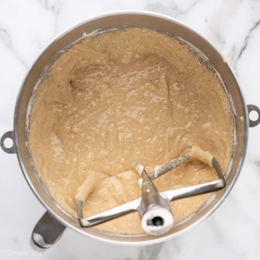 overhead of a mixer with batter for coffee cake muffins
