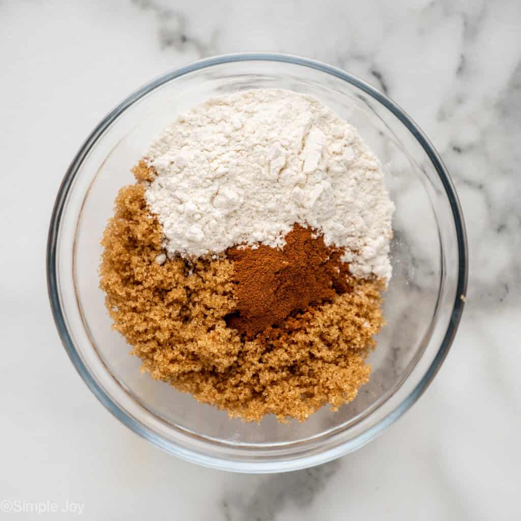 overhead of a bowl of brown sugar, cinnamon, and flour