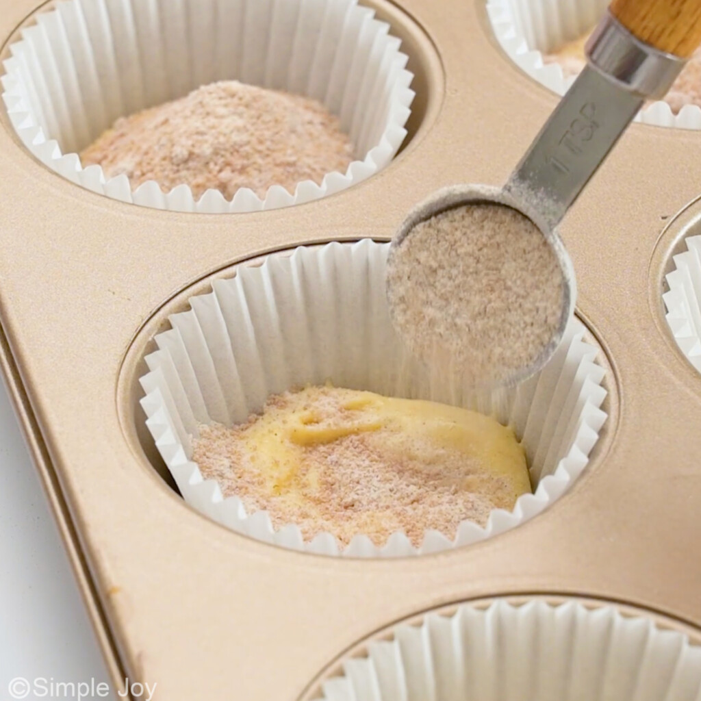 adding filling to unbaked coffee cake muffins