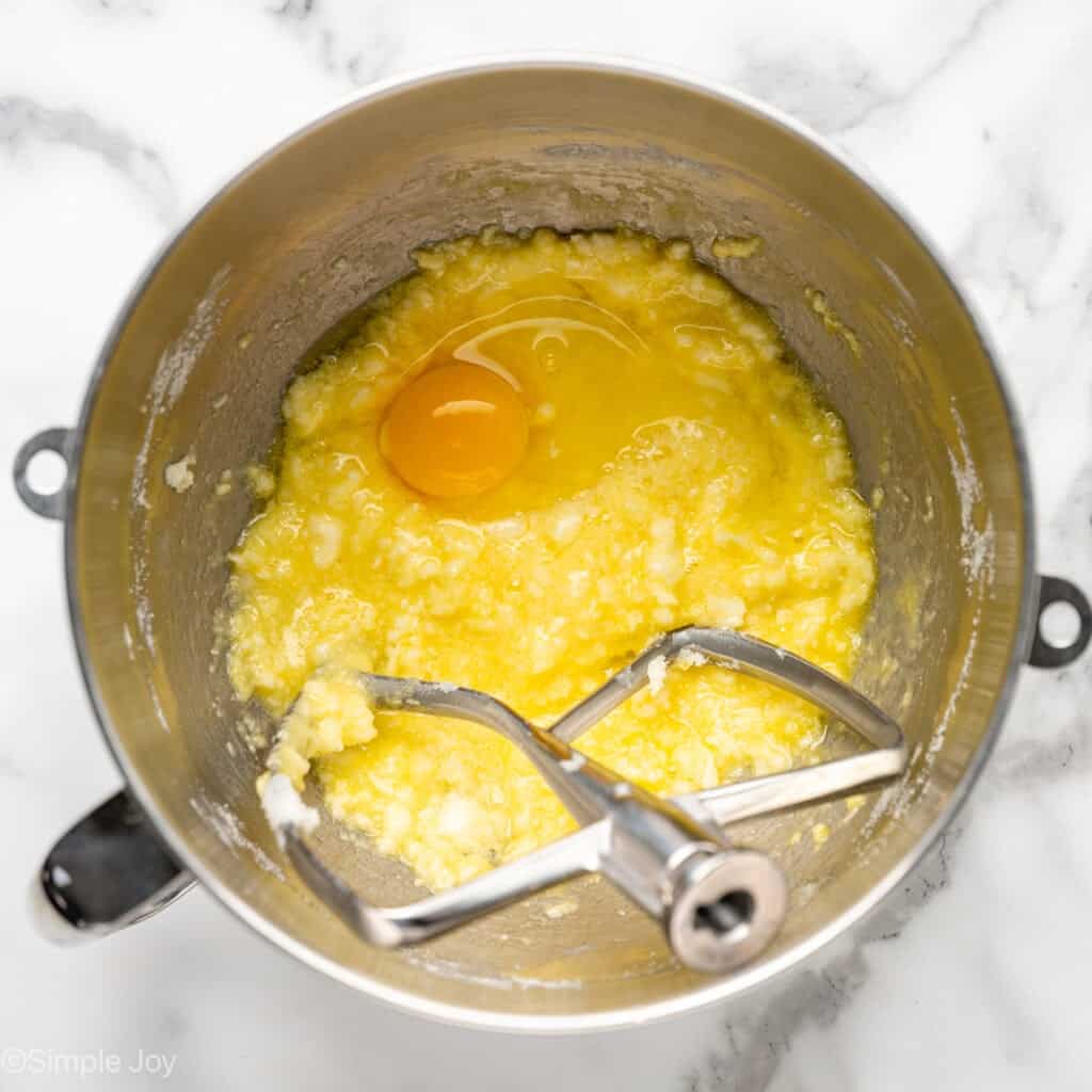 adding eggs to creamed butter and sugar