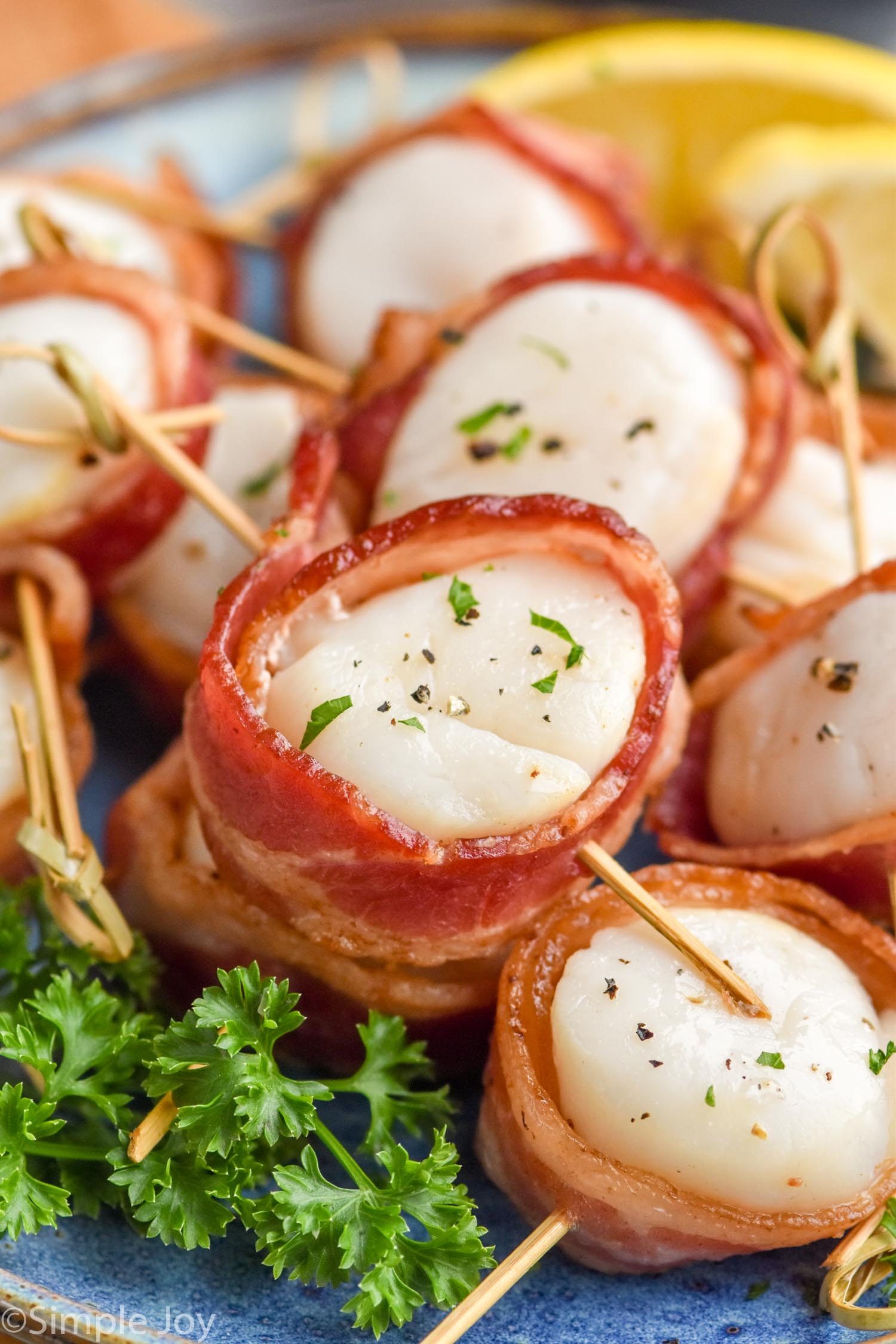 Close up photo of Bacon Wrapped Scallops on a plate