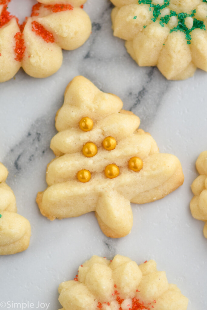 Close up overhead photo of Spritz Cookies decorated with sprinkles