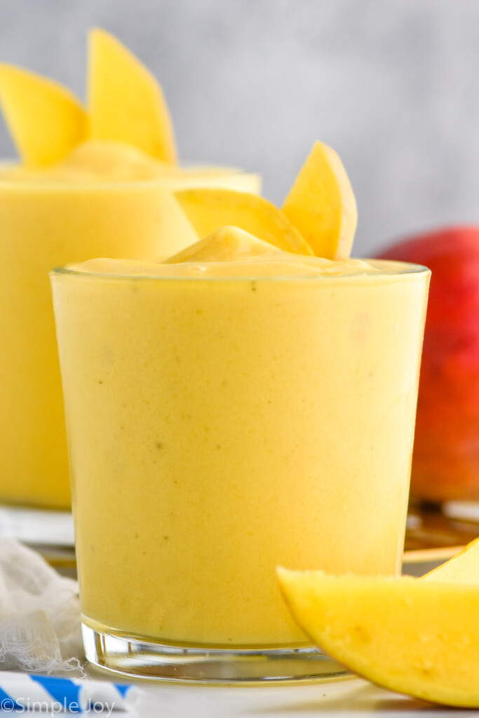Side view of Mango Smoothies garnished with mango slices