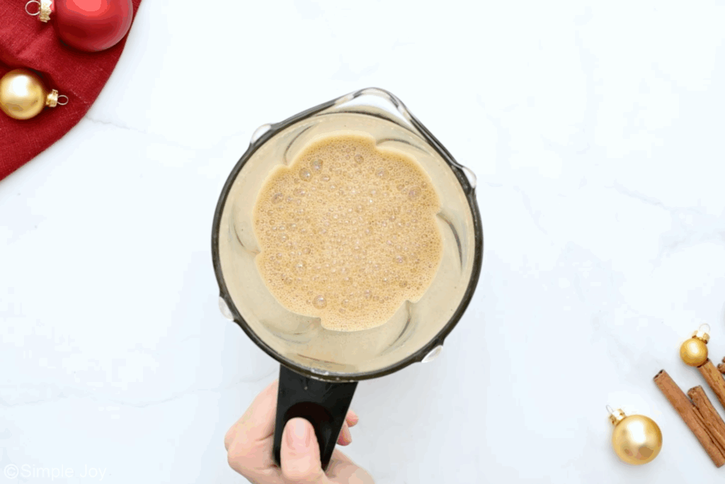 overhead of blender of eggnog latte ingredients - 6