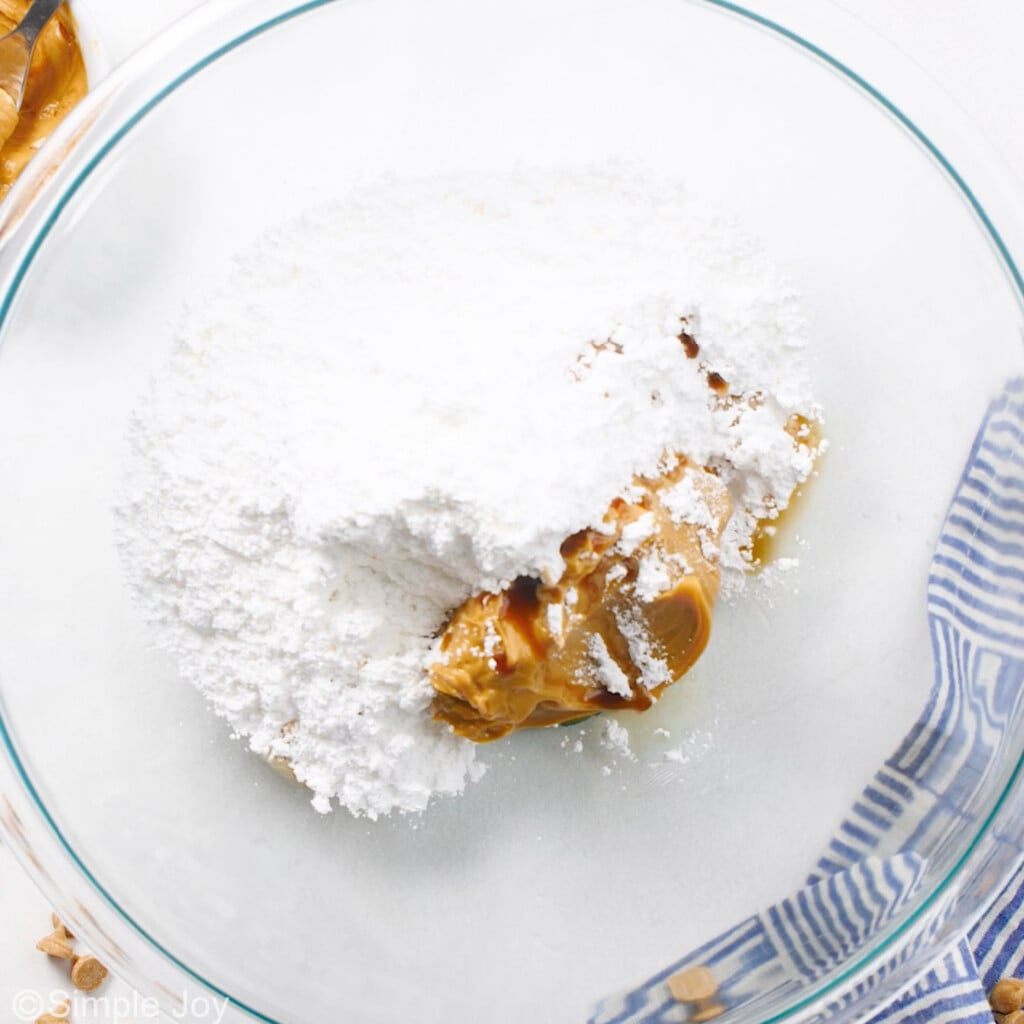 overhead of a bowl with powdered sugar and peanut butter to make peanut butter