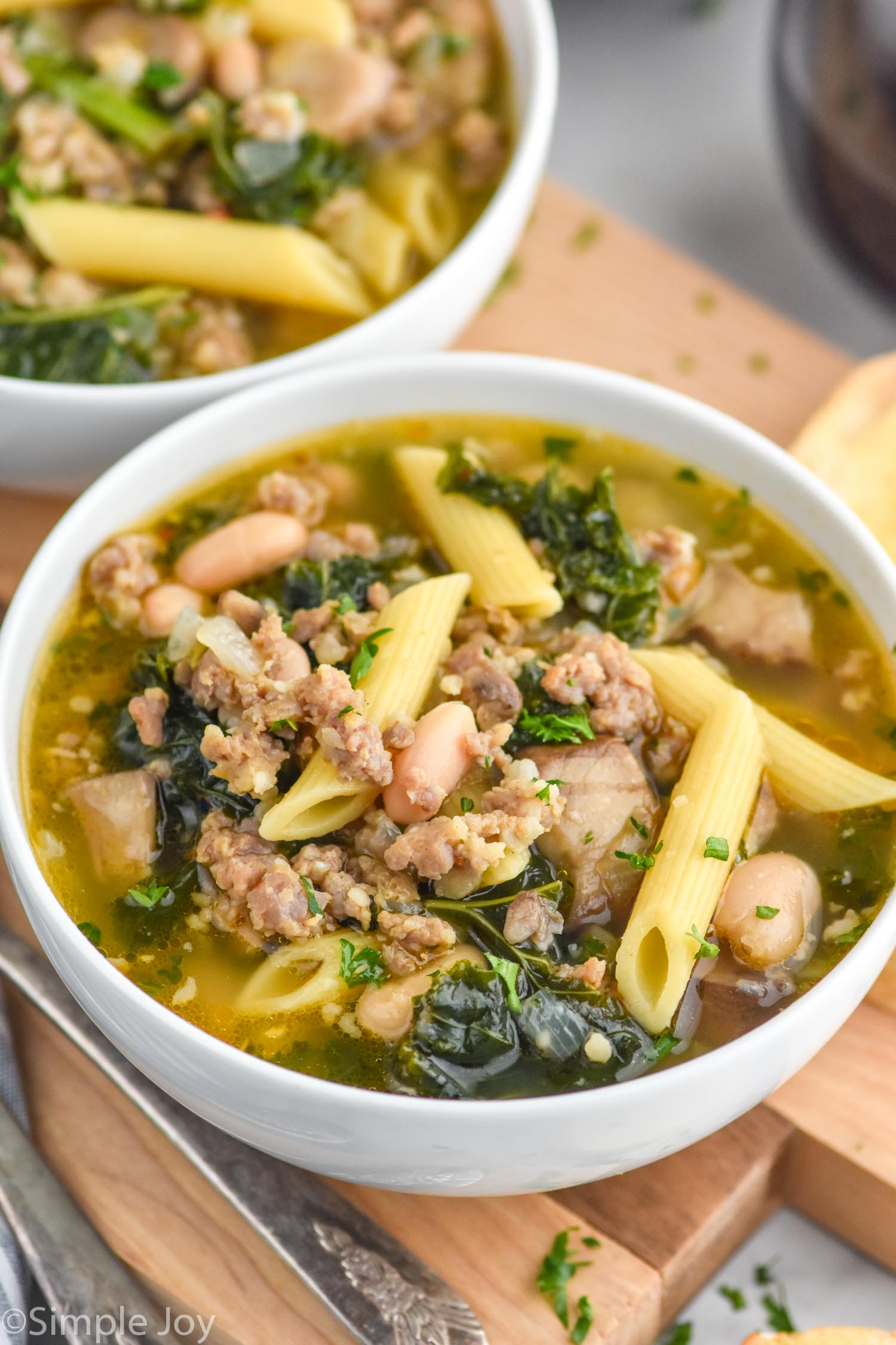 Bowls of sausage and kale soup