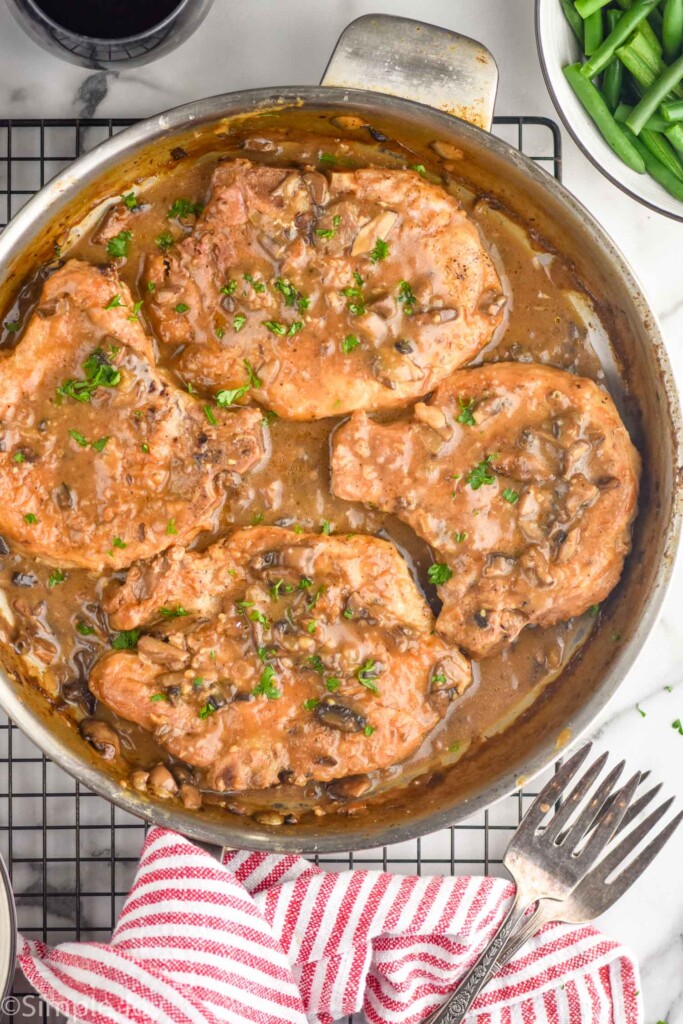 Overhead of pan of Smothered Pork Chops