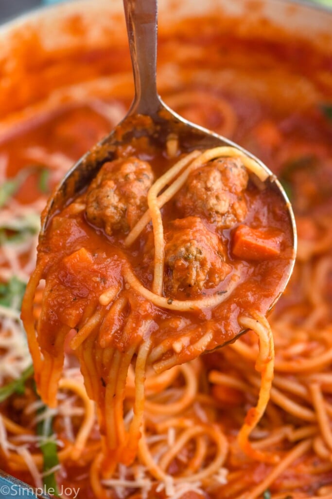 Close up photo of ladle of Meatball Soup over pot.