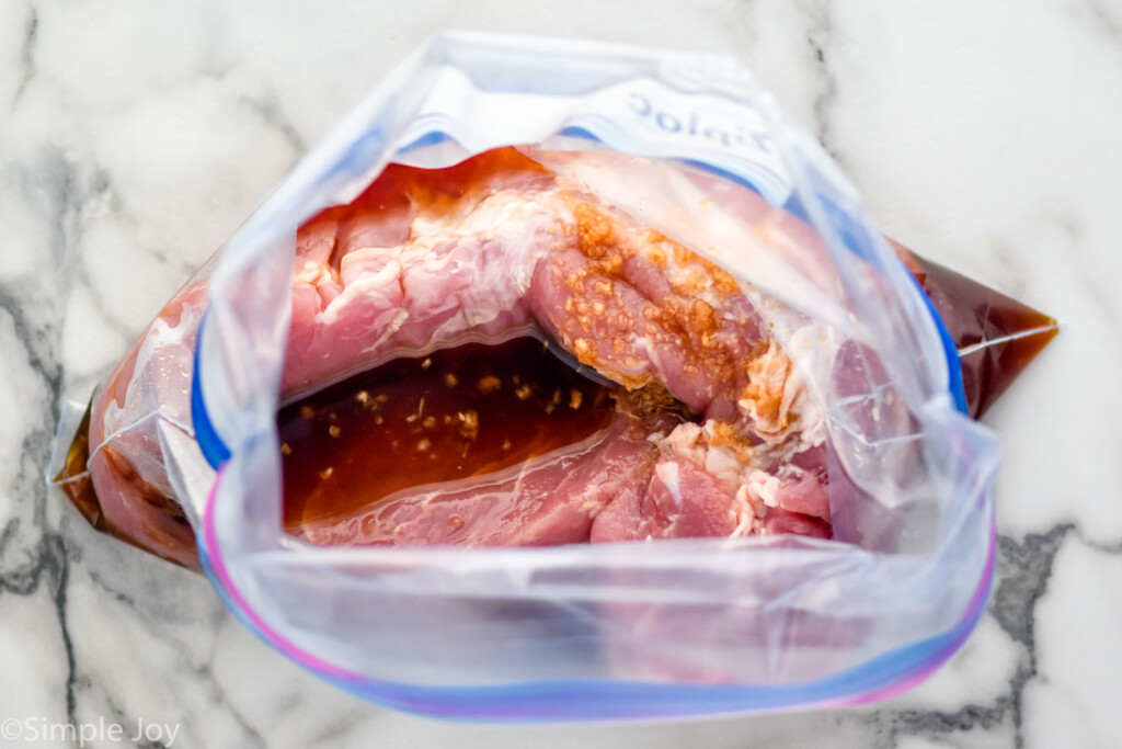 Overhead of pork in a bag with marinade for Teriyaki Pork Tenderloin recipe.
