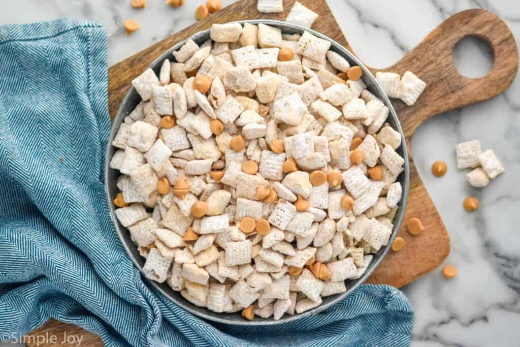 Overhead view of a bowl of Butterscotch Muddy Buddies on a serving platter