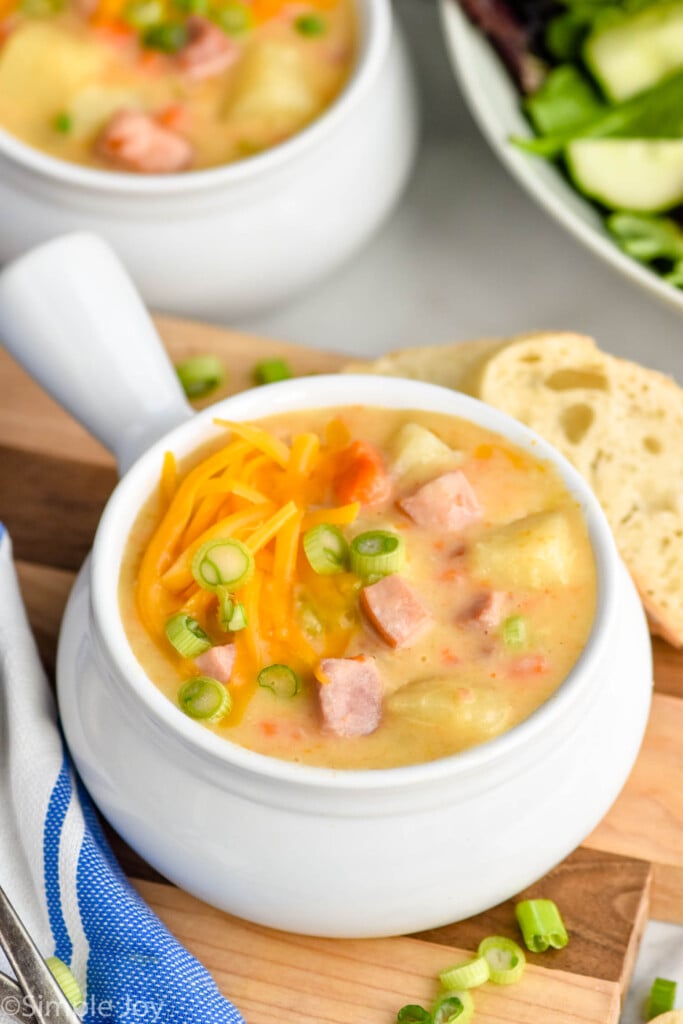 Bowls of Ham and Potato Soup with bread beside