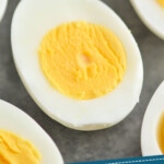 Pinterest graphic for Hard boiled eggs recipe. Image shows Hard boiled eggs cut in half. Text says, "how to make Hard boiled eggs simplejoy.com"