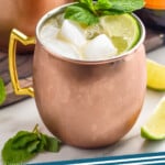 Pinterest graphic for Irish Mule recipe. Image shows Irish Mule with lime wedges and mint leaves. Text says, "Irish Mule simplejoy.com"
