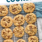 Pinterest graphic for Oatmeal Chocolate Chip Cookies recipe. Text says, "the best Oatmeal Chocolate Cookies simplejoy.com." Image is overhead view of Oatmeal Chocolate Chip Cookies on a cooling rack