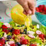 Pinterest graphic for Poppy Seed Dressing recipe. Text says, "the best Poppy Seed Dressing simplejoy.com." Image shows person's hand pouring Poppy Seed Dressing over salad.