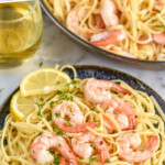 Pinterest graphic for Shrimp Linguine recipe. Text says, "the best Shrimp Linguine simplejoy.com" Image shows a plate of Shrimp Linguine with lemon slices