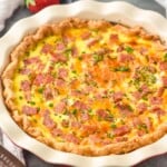 Ham and Cheese Quiche with fruit beside