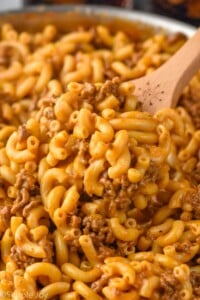 Skillet of Hamburger Helper with a spoon