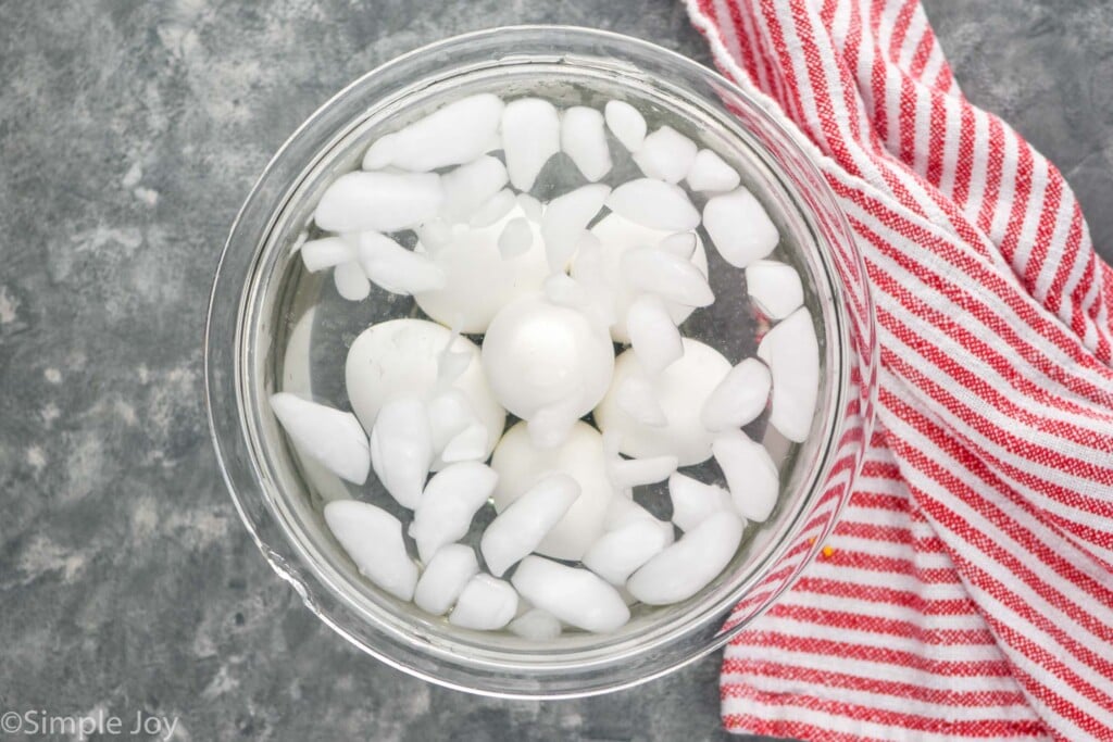Overhead view of bowl of ice water with Hard boiled eggs