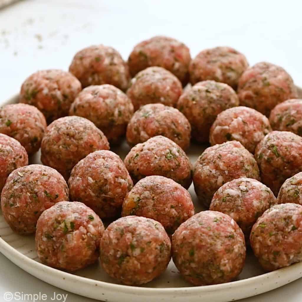 uncooked meatballs on a plate
