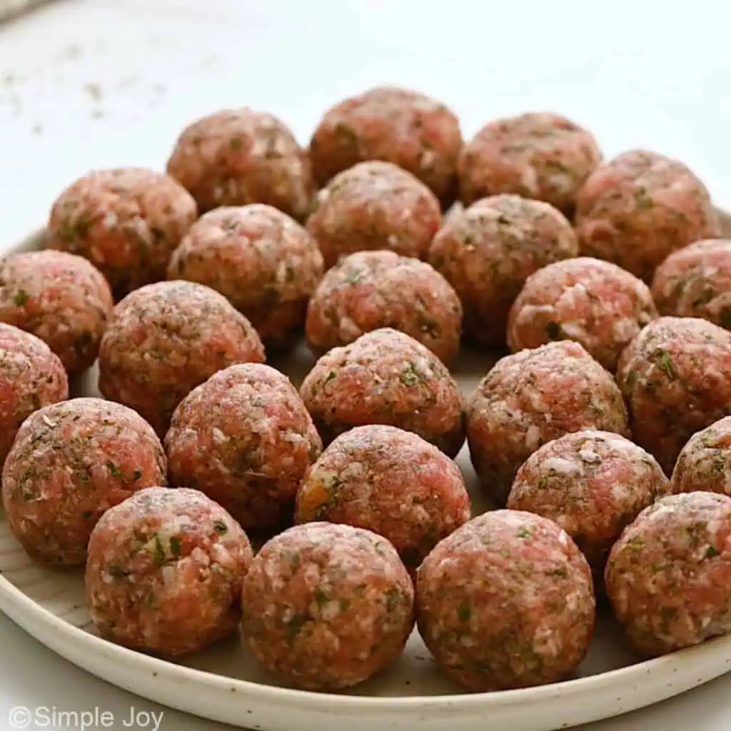 uncooked meatballs on a plate