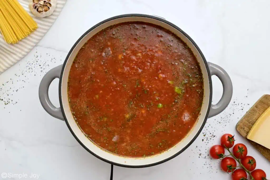 overhead of a stock pot with broth to cook meatballs for meatball soup - 6