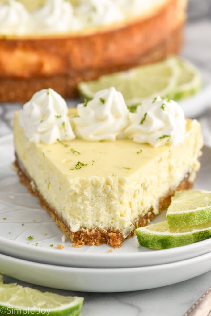 close up of a piece of lime cheesecake with a bite out of it