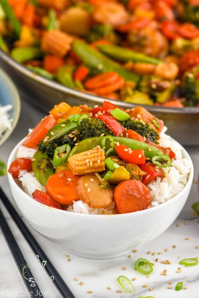 bowl of Vegetable Stir Fry with rice. Skillet of Vegetable Stir Fry