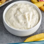 Pinterest graphic for Garlic Aioli recipe. Image shows a dish of Garlic Aioli and french fries. Text says, "Garlic Aioli simplejoy.com"