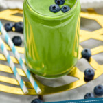 Pinterest graphic for Green Smoothie recipe. Image shows Green Smoothie with blueberries and straws. Text says, "3 ingredient Green Smoothie simplejoy.com"